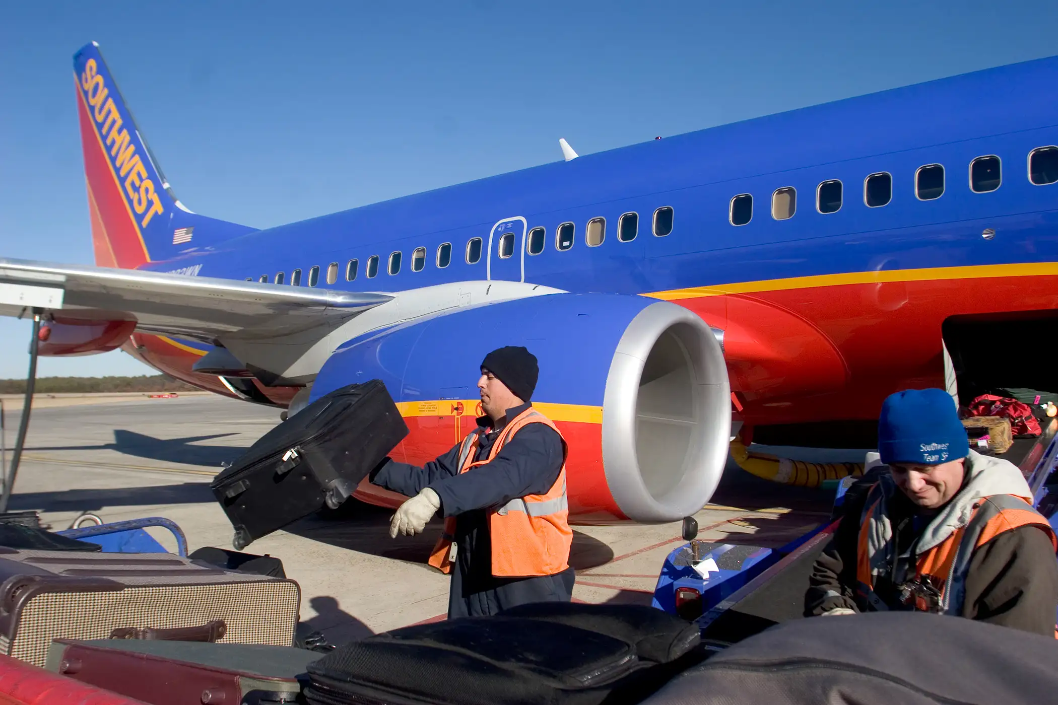 Southwest Airlines luggage handlers tossing bags