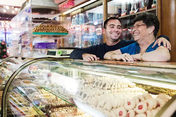 mother and son in deli patisserie store