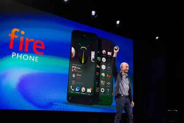 Jeff Bezos, chief executive officer of Amazon.com Inc., unveils the Fire Phone during an event at Fremont Studios in Seattle, Washington, U.S., on Wednesday, June 18, 2014.