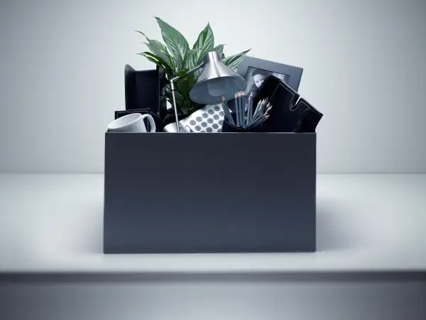 box of office supplies on desk