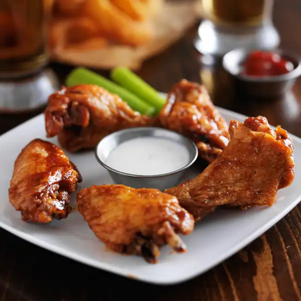 Chicken wings on plate in restaurant