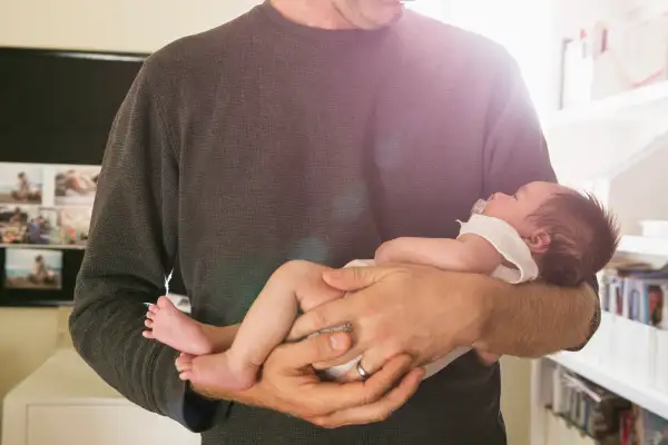 Father holding newborn