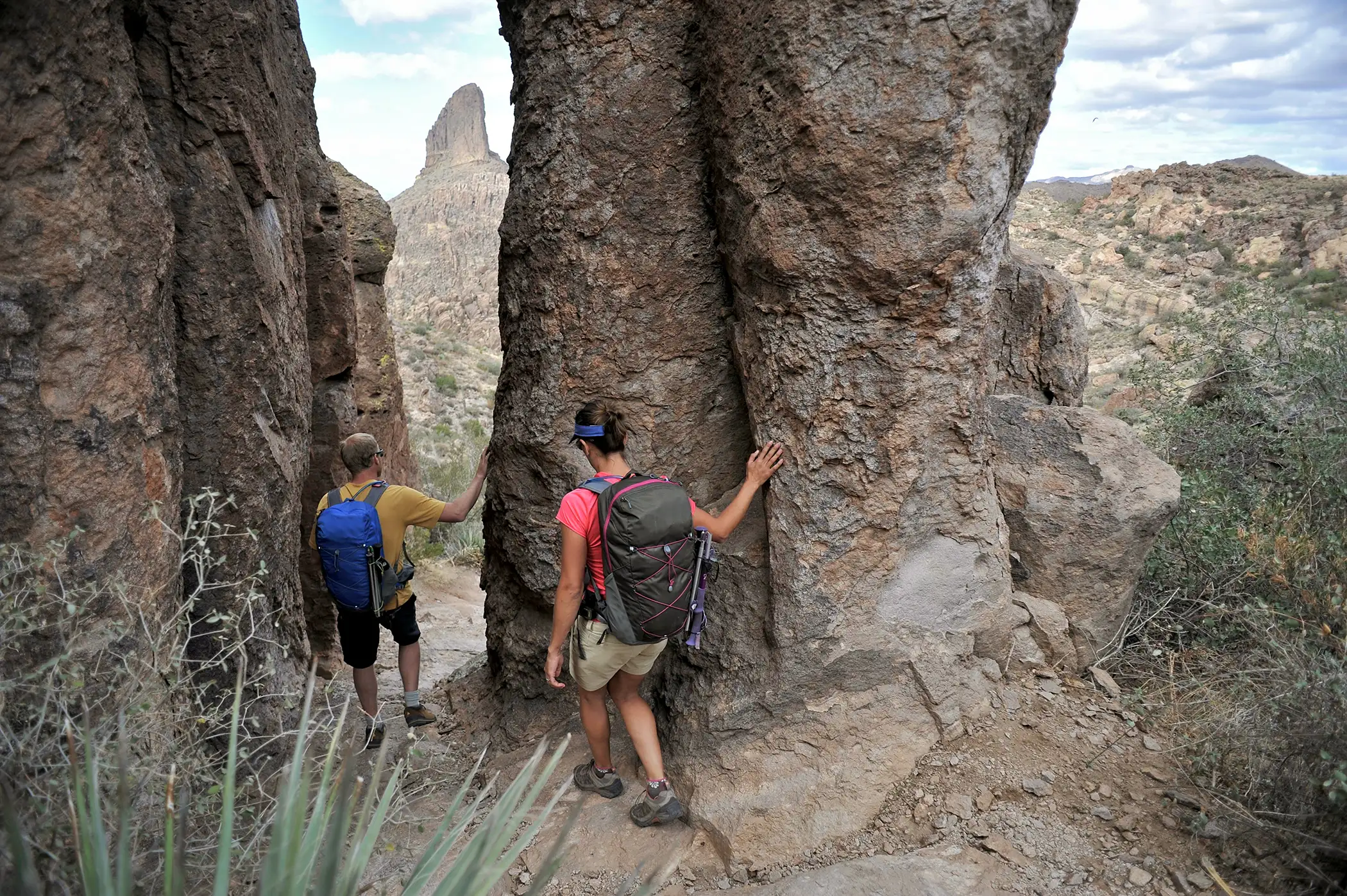 Hikers on the Fremont Saddle on the popular Peralta Trail in the Superstition Wilderness Area, Tonto National Forest near Mesa, Arizona