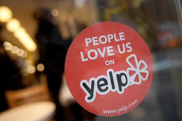 A Yelp sticker in the window of a restaurant in New York on Thursday, March 1, 2012