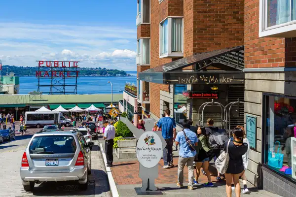 View down Pine Street of Pike Place Market with Inn at the Market in foreground, Seattle