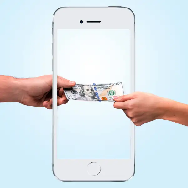 hand passing money through iPhone 6 frame