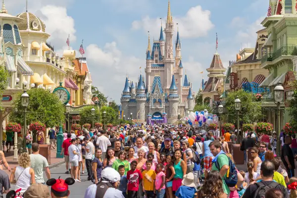 Visitors walking on Main Street near Cinderella's Castle in the Magic Kingdom in Walt Disney World in Florida