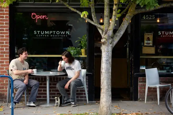 Danny and Donny Johnson of Portland, Oregon drink coffee outside of Stumptown Coffee Roasters on October 6, 2015 in Portland, Oregon.