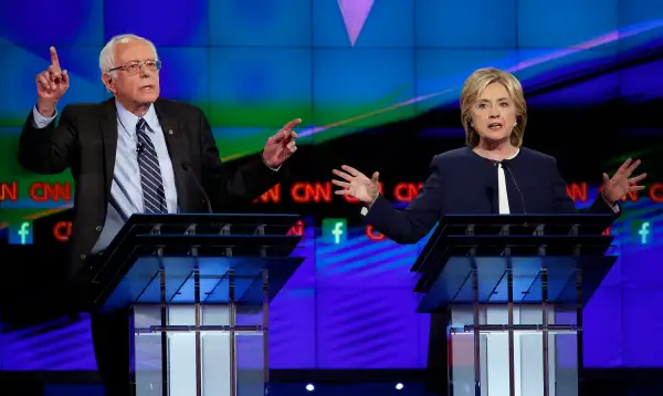U.S. Senator Bernie Sanders (L) and former Secretary of State Hillary Clinton debate duringthe first official Democratic candidates debate of the 2016 presidential campaign in Las Vegas, Nevada October 13, 2015