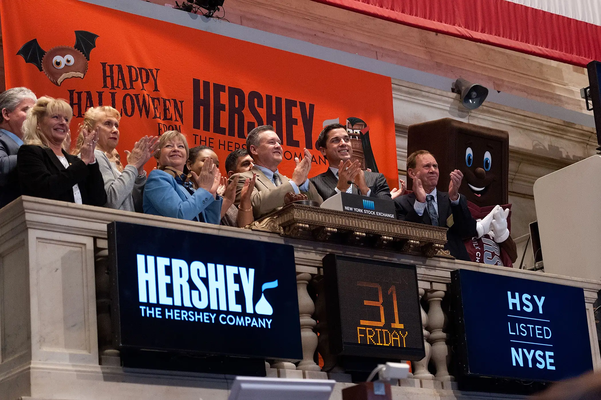 The Hershey Company president and CEO J.P. Bilbrey (C) rings the NYSE Opening Bell at the New York Stock Exchange on October 31, 2014 in New York City.