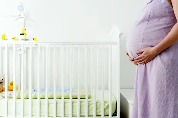 pregnant mom in nursery