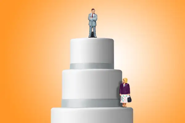 cake with businessman on top tier and businesswoman on lower tier