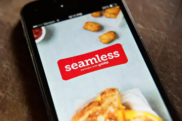 The Seamless app is displayed on an Apple Inc. iPhone 5 in Tiskilwa, Illinois, on April 2, 2014.