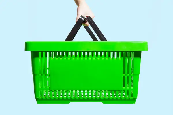 hand holding shopping basket