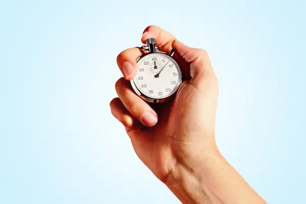 hand holding stopwatch