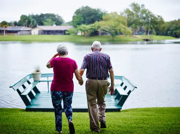 Dick Pell looks after his wife, Helen, at their Sarasota home.