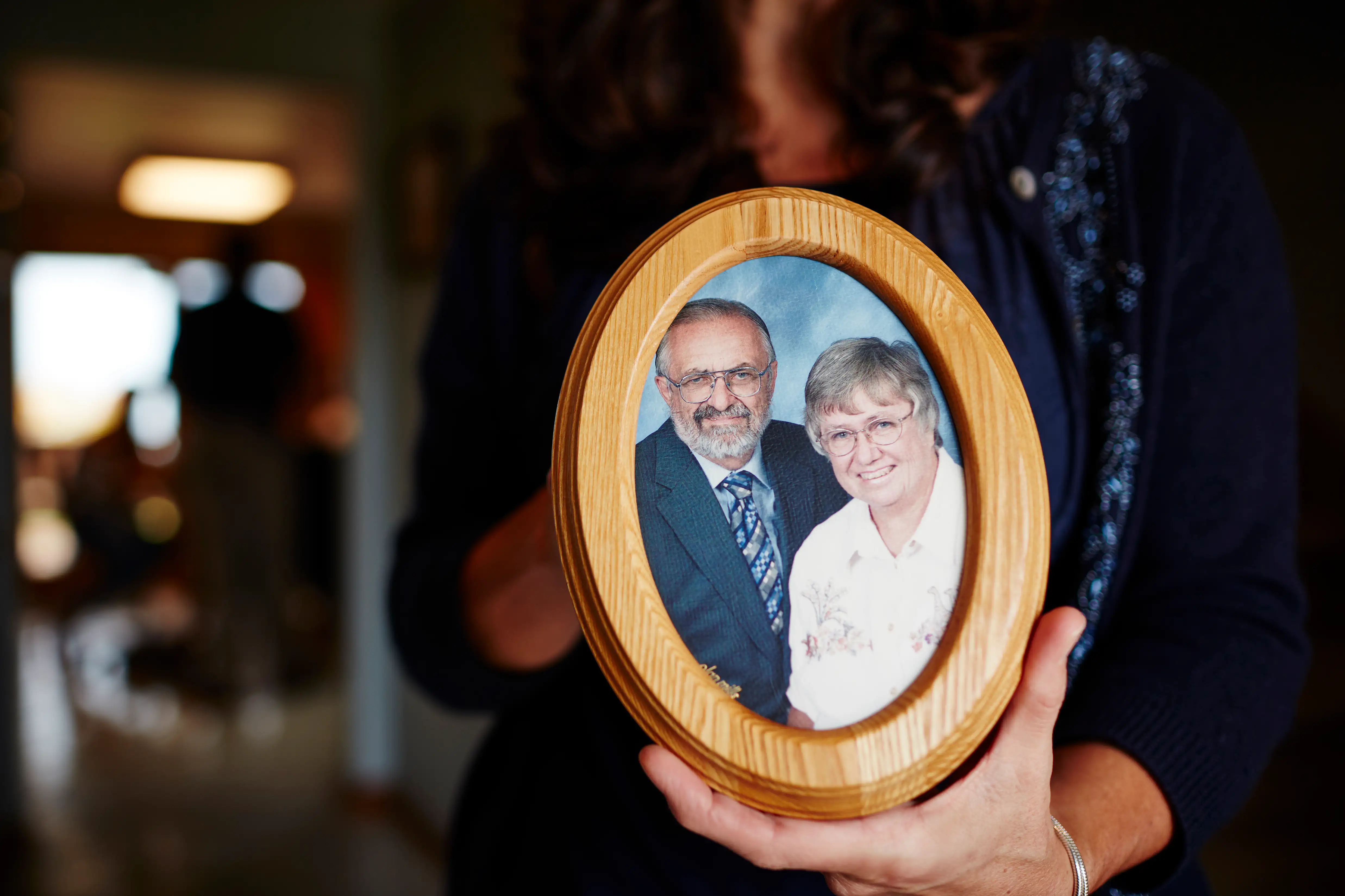 Theresa Von Vreckin holds a photo of her parents