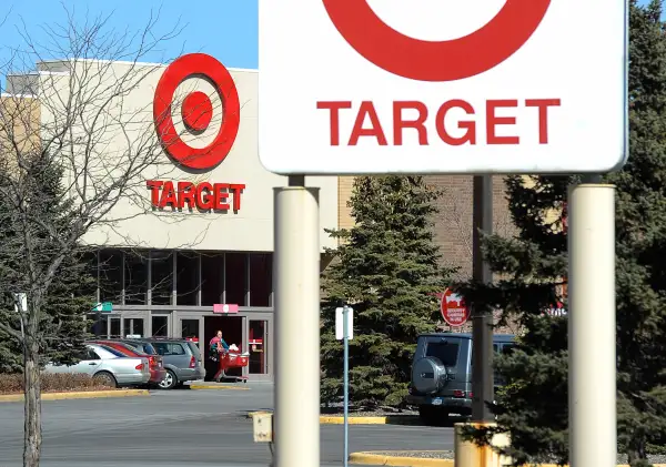 A shopper leaves a Target store in St Louis Park, Minnesota March 10, 2015.