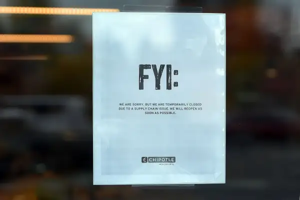 A sign hangs on the door of a Chipotle Mexican Grill store location in on November 3, 2015 in Vancouver, Washington. Chipotle Mexican Grill is temporarily closing more than 40 restaurants in and around Washignton and Oregon, as health officials investigate an E. coli outbreak that has gotten at least 22 people sick.