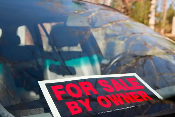 for sale by owner sign in window of car