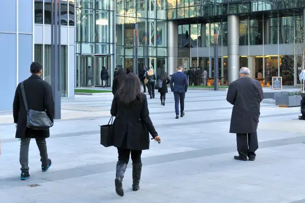 woman walking into office building