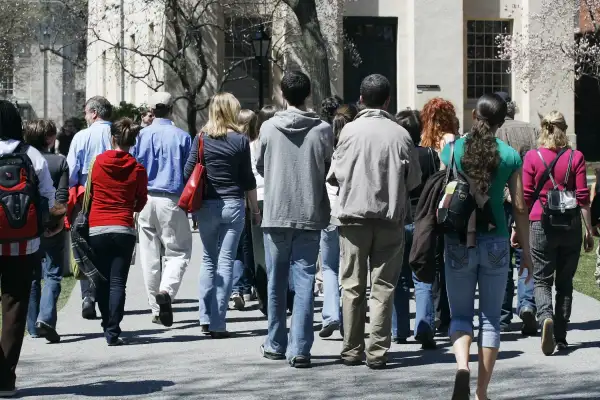 students on college campus tour