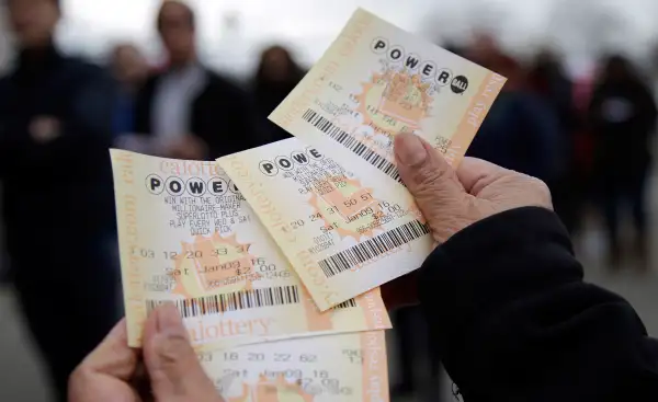 In this January 9, 2016 photo, Powerball tickets are shown in San Lorenzo, Calif. No ticket matched all six Powerball numbers following the drawing for a record jackpot of nearly $950 million, lottery officials said early January 10, boosting the expected payout for the next drawing to a whopping $1.3 billion.