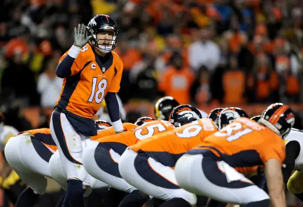 Peyton Manning #18 of the Denver Broncos calls a play against the Pittsburgh Steelers during the AFC Divisional Playoff Game at Sports Authority Field at Mile High on January 17, 2016 in Denver, Colorado.