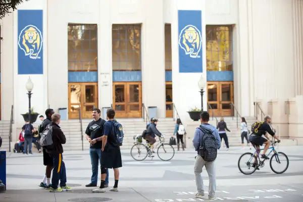 Students and visitors walk across campus at the University of California Berkeley, on February 19, 2014 in Berkeley, California.