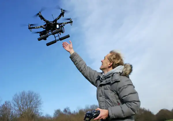 person flying drone