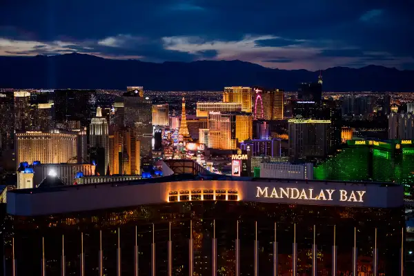 Mandalay Bay Resort And Casino, front center, and MGM Resorts International Grand Hotel & Casino, right, stand on The Strip in this aerial photograph taken at dusk above Las Vegas, on August 5, 2015.