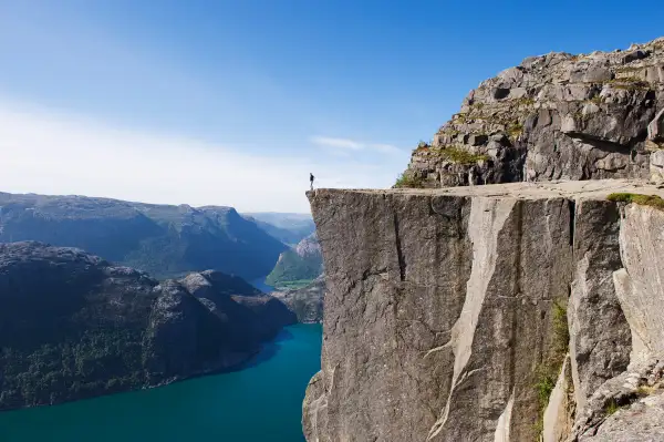 man standing on edge of cliff