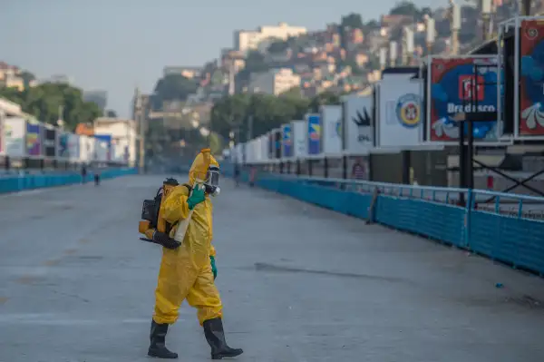 A municipal agent sprays anti Zika mosquitos chimical product at the sambadrome in Rio de Janeiro, on January 26, 2016. Brazil is mobilizing more than 200,000 troops to go  house to house  in the battle against Zika-carrying mosquitoes, blamed for causing horrific birth defects in a major regional health scare, a report said Monday.