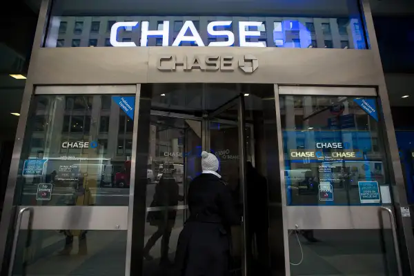 Customers enter a JPMorgan Chase bank branch in New York, on January 12, 2016.