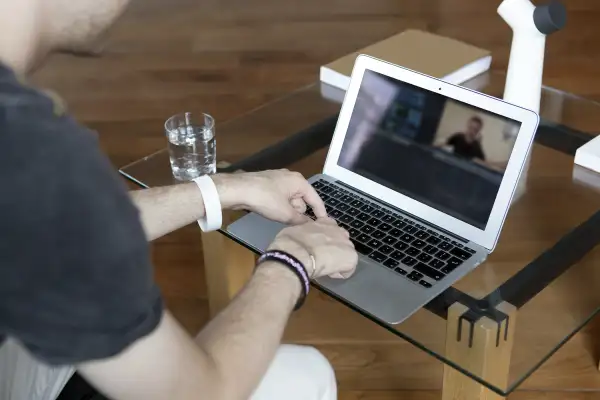 man working on laptop at home