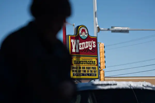 A customer is seen leaving a Wendy's restaurant in Peoria, Illinois, on February 2, 2015.