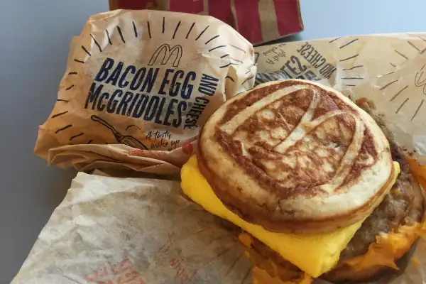 This Thursday, Jan. 28, 2016, photo, shows a McDonald's McGriddle sandwich in New York. McDonald’s plans to push its operational limits by testing the addition of the McGriddle to its all-day breakfast menu. The move comes after the company reported its biggest U.S. sales jump in nearly four years, following the launch of all-day breakfast in October.