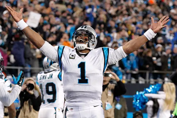 Carolina Panthers quarterback Cam Newton (1) celebrates after a touchdown against the Arizona Cardinals in the NFC Championship football game at Bank of America Stadium, January 24, 2016.