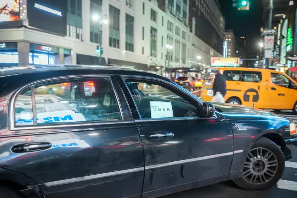An Uber livery travels through Midtown Manhattan in New York on January 12, 2016.