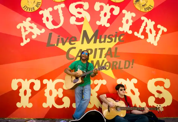 Boy Wonder perform in front of a mural on 6th Street during SXSW