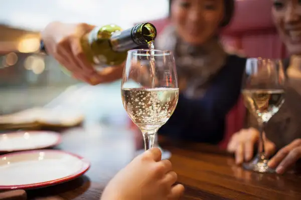 woman pouring wine