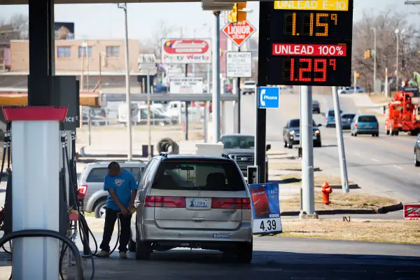 A motorist fills his car with gas February 12, 2016 in Oklahoma City, Oklahoma. Earlier this week prices were cheaper but most gas stations in Oklahoma City were posting higher gas prices today. Prices are expected to start inching upward as spring approaches and refiners begin to throttle back on production to combat oversupply at the same time that demand begins to rise.