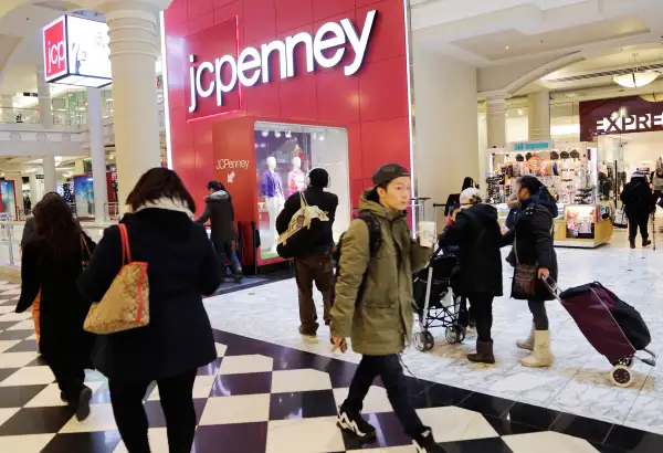 In this February 19, 2015 photo, shoppers visit a J.C. Penney store in New York.