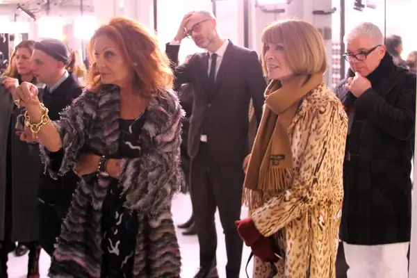 Designer Dian von Furstenberg talks with EIC of American Vogue Anna Wintour during the Diane von Furstenberg fashion presentation during New York Fashion Week at 440 W 14th St on February 14, 2016 in New York City.