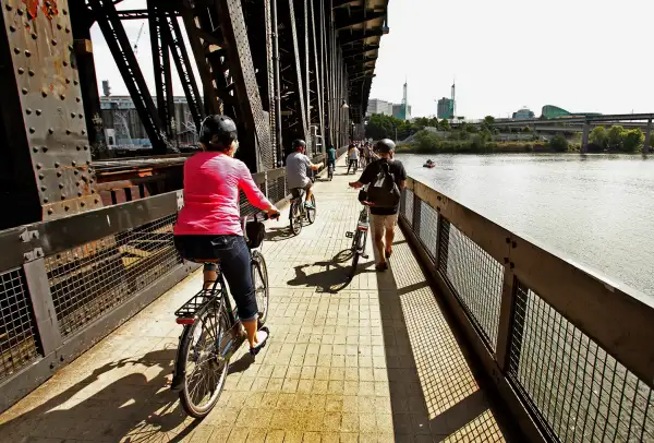 Biking over a bridge in Portland, OR