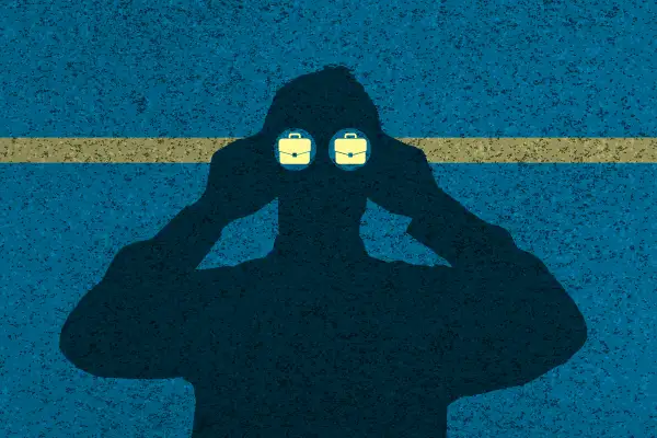 silhouette of man looking through binoculars and seeing briefcases