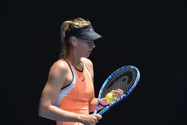 Russia's Maria Sharapova prepares to serve during her women's singles match against Serena Williams of the US on day nine of the 2016 Australian Open tennis tournament in Melbourne on January 26, 2016.
