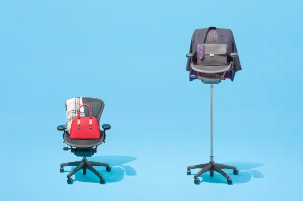 office chairs of two different heights, with male and female fashion accessories draped on them
