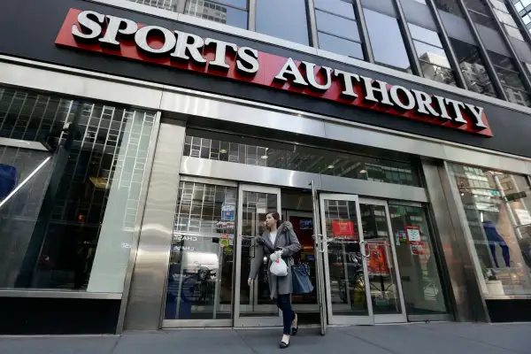 A woman leaves a Sports Authority store, in New York, Wednesday, March 2, 2016. Sports Authority is filing for Chapter 11 bankruptcy protection. The Englewood, Colo., company has 463 stores in 41 states and Puerto Rico.