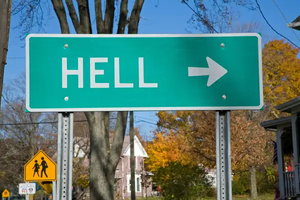 A road sign points towards the small town of Hell, Michigan
